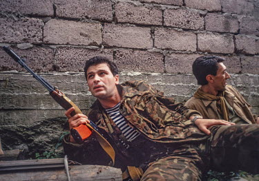 Members of the Georgian Army take shelter from incoming mortar fire by separatists in the hills on the outskirts of Sukhumi during the Georgian Abkhazian War in 1993.   Abkhazia was a break away aut...