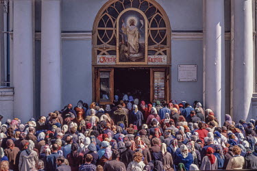 A crowd enters a church. After the collapse of Communism large numbers of Russians embraced Russian Orthodoxy for the first time and others displayed their religion more openly after having remained O...