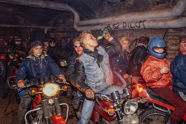 A biker group, drinking beer and riding through underground tunnels on their motorcycles late at night. This was a sign of the loosening of state control on people's lives in the early 1990s. This kin...