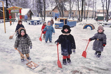 Kindergarten children playing in the snow in a Moscow suburb.