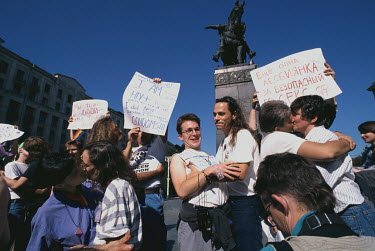 Same sex couples kiss during a gay rights demonstration. During the end of the Gorbachev era Russian gay rights activists were coming coming out of hiding and publicly proclaiming their sexuality whil...