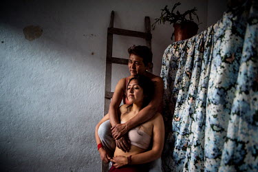 The photographer with her mum, Monica Alvarez, in her childhood bedroom, taken during the Covid-19 pandemic. Monica is a doctor and physical contact during the pandemic was limited for fear of contagi...