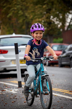 A young girl on a segregated cycle lane in South London.
