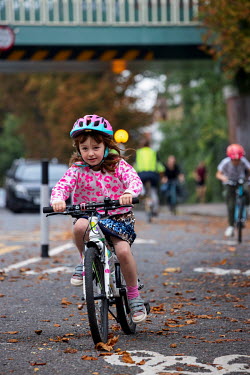 A young girl on a segregated cycle lane in South London.