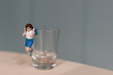 'Fuchico on the cup', part of a range of gachapon (capsule) toys which feature a manga style woman in smart work clothing in different poses that can attach to a cup. Produced by manufacturer Kitan Cl...