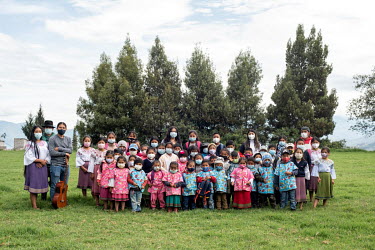 Group portrait of teachers and students of Patricio Bermeo School in San Clemente. This Karanki Indigenous Community is located in northern Ecuadorian highlands. Before the Covid 19 pandemic, the scho...