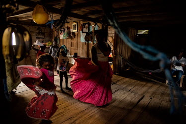 Yuli Ayovi, 27, is teaching marimba, dance of African descent, to children at her home. Community education in Playa de Oro is lead by young mums who choose to include activities which reinforce Afro...