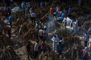 Mass cremation of people who died from coronavirus at a crematorium in New Delhi, India.