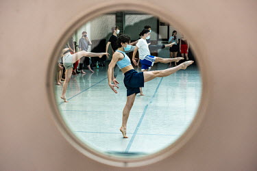 Dancers of the Ballet Junior Geneve about to start a training session at L'Imprimerie. All performances have been cancelled, but training continues, during a partial lockdown that essentially closed d...
