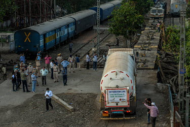 Cryogenic tanker carrying medical oxygen from Odisa state is unloaded from the train at Cantt station in Delhi.