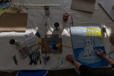 Volunteers paint placards in the Queen Margarets Union at the University of Glasgow ahead of Fridays for Future march, 5th November 2021, in Glasgow, Scotland. The event coincides with the COP26 Summi...