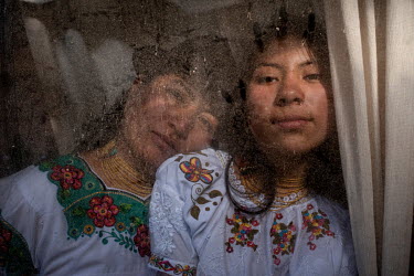 María Isolina Pupiales, 38 years old, and her daughter Sharik Nayeli Guatemal, 15 years old, singers from the Karanki indigenous community, pose for a portrait at their home.
