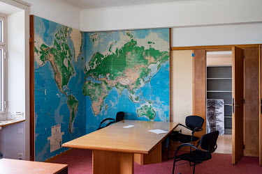 An empty office, with a large world map as decoration, prior to being stripped for renovation in the Palais des Nations, the United Nations Office at Geneva, which is being renovated, part of an 800US...