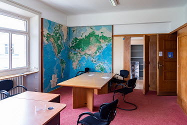 An empty office, with a large world map as decoration, prior to being stripped for renovation in the Palais des Nations, the United Nations Office at Geneva, which is being renovated, part of an 800US...