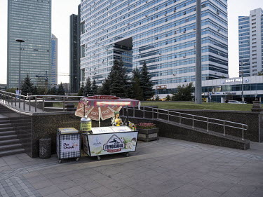 An ice cream vendor stands at her stall along Nurzhol Boulevard in central Nur-Sultan.