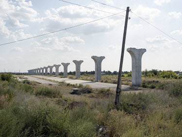 Pillars for the incomplete Light Rail Transit (LRT) system, a metro line from Nazarbayev International Airport to Nurly Zhol railway station. Locals call the pillars their monument to corruption since...