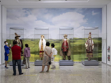 Visitors are shown traditional Kazakh costumes at the National Museum of the Republic of Kazakhstan.