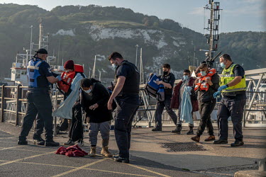 Refugees picked up in the English Channel is brought ashore by Border Force at Dover.