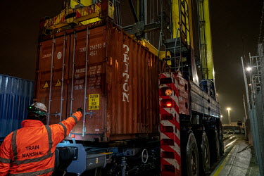 A freight train is loaded with 650,000 bottles of wine at Tilbury Docks, east of London. Due to supply problems and driver shortages caused by Brexit and the Pandemic, wine is now being sent by train...