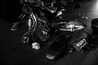 A damaged delivery scooter at the scene of an accident.