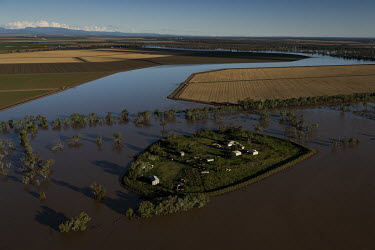 Several farms have been completely cut off by rising floodwaters. Some farmers are using helicopters to move around, while others are using canoes and kayaks to reach dry land. The floods are destroyi...