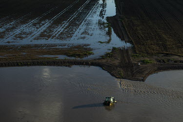 A tractor submerged in flood water on a farm close Wee Waa.