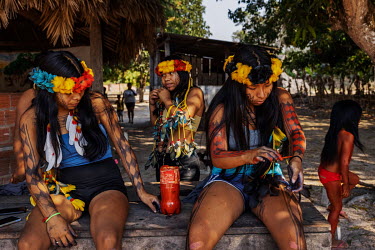 Manoki youths paint their bodies for a cultural event in an Irantxe Manoki indigenous village in Mato Grosso.
