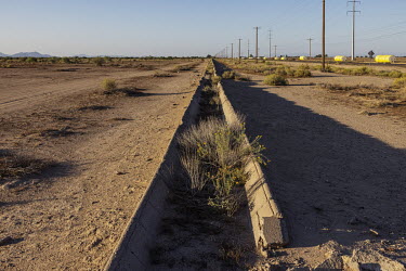 Dry irrigation canal in rural Casa Grande on the outskirts of Phoenix. The severe drought that has hit this region has created a water dispute between urban dwellers and farmers.