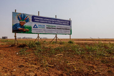 A billboard along the BR 364 highway near Campo Novo dos Parecis promotes mechanised agriculture on indigenous land with an image of indigenous leader Arnaldo Zunizakae.