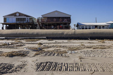 Protection dike, nicknamed 'burrito', in front of houses on the beach of Grand Isle, on the coast of Louisiana, after the passage of Hurricane Ida.