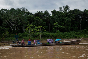 'Ribeirinhos' local people who live alongside the water, navigate the Purus River in the Arapixi (traditional) Extractive Reserve, in Amazonas.