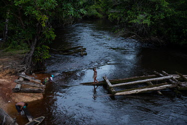 Indigenous people from the Ya Mirim community bathe in a river in the Balaio Indigenous Territory, in the region of Sao Gabriel da Cachoeira. The community is the closest one to Morro dos Seis Lagos,...