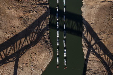 Boats are anchored in one of the remaining branches of the Orville Dam lake in California. The severe drought in California has caused the lake to reach its lowest level in its history.