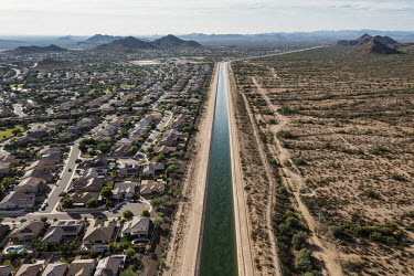 The 'Central Arizona Project' canal, which collects water from the Colorado River and crosses Arizona to distribute water to the state's cities, passes next to a suburb of Phoenix. The city, located i...