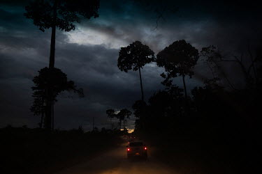 A convoy of officials from the Para State Environment Agency escorted by military police travels along a side road from Uruara, Para state, during an operation to combat deforestation.