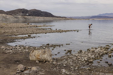 Families have fun on the shores of Lake Mead, the largest artificial reservoir in the United States which is at its lowest ever level.