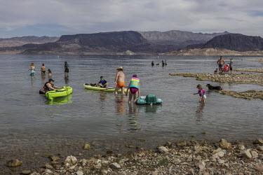 Families have fun on the shores of Lake Mead, the largest artificial reservoir in the United States which is at its lowest ever level.