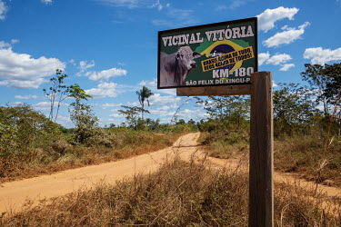 A sign on a local road inside the Apyterewa Indigenous Territory, with bullet holes and a sticker supporting President Jair Bolsonaro.