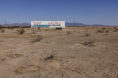 An advertisement of the sale of land in rural Maricopa County, Arizona, one of the regions hardest hit by drought in the USA. The severe drought that has hit the state has been driving farmers out of...