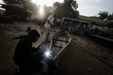 Welders make boats out of barrels which are urgently needed to move around the flooded plains of Unity State. Hundreds of thousands of people have been displaced by flooding which is occurring for the...