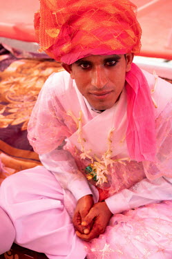 A groom, one of four couples preparing for a 'mass' wedding paid for by the local community.