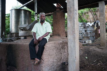 Darmine Daoud at his ylang ylang oil distillery in Hachipenda on the island of Anjouan in the Comoros. Daoud has invested in wood efficient processes supported by a local NGO. The highly scented oil d...