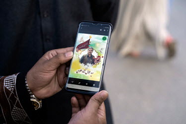 A photograph, displayed on a smartphone, of a Shiite martyr, killed in the bombing of the Fatemyah mosque in Kandahar, the target of an 15 October 2021 attack by Ismalic State (Daesh) that left 47 peo...
