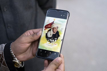 A photograph, displayed on a smartphone, of a Shiite martyr, killed in the bombing of the Fatemyah mosque in Kandahar, the target of an 15 October 2021 attack by Ismalic State (Daesh) that left 47 peo...