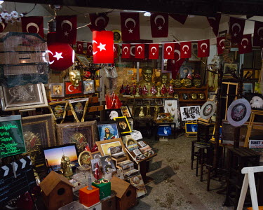 Busts and imagery of Mustafa Kemal Ataturk crowded amongst other religious and political iconography, in a shop in Galata.