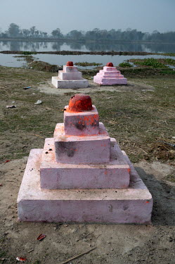 Pink painted monuments (srisoptas) to women who have fasted to bring merit to their families.