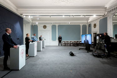 Danish Prime Mette Frederiksen, with various advisors in the Prime Minister's office, talks at a virtual press conference where during her 23 minute speech she annouces that schools are to be partiall...