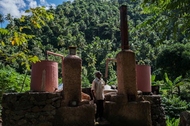 Said Bacar at his ylang ylang oil distillery near Moya on the island of Anjouan in the Comoros. He and his wife live in a shed immediately behind the distillery. He estimates his age at 82, and after...