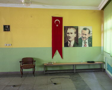 Portraits of Turkey's founding father, Mustafa Kemal Ataturk (left) and current president, Recep Tayyip Erdogan (right) hang on the walls at Erdogan's former football team, Erok Spor club.