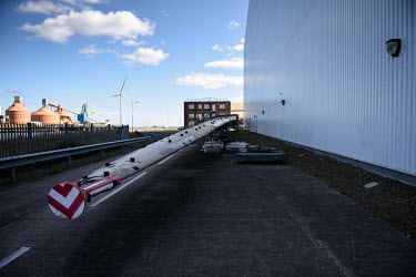 A 100 metre long wind turbine blade is stationed outside a vast wind turbine blade testing building, at the Catapult Innovation and Research Centre for Offshore Renewable Energy. The former coal minin...